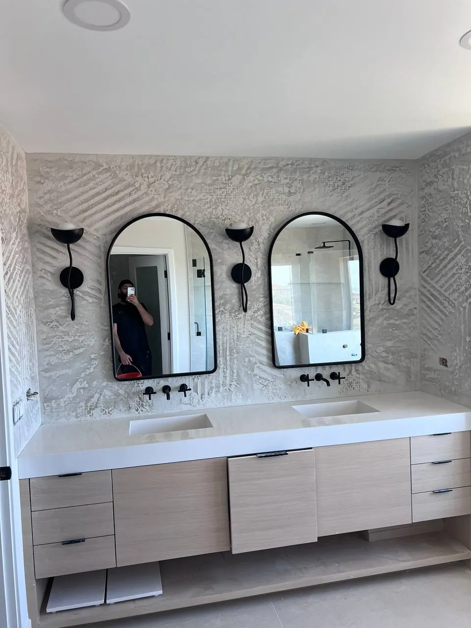 Double vanity with two round mirrors in a modern bathroom