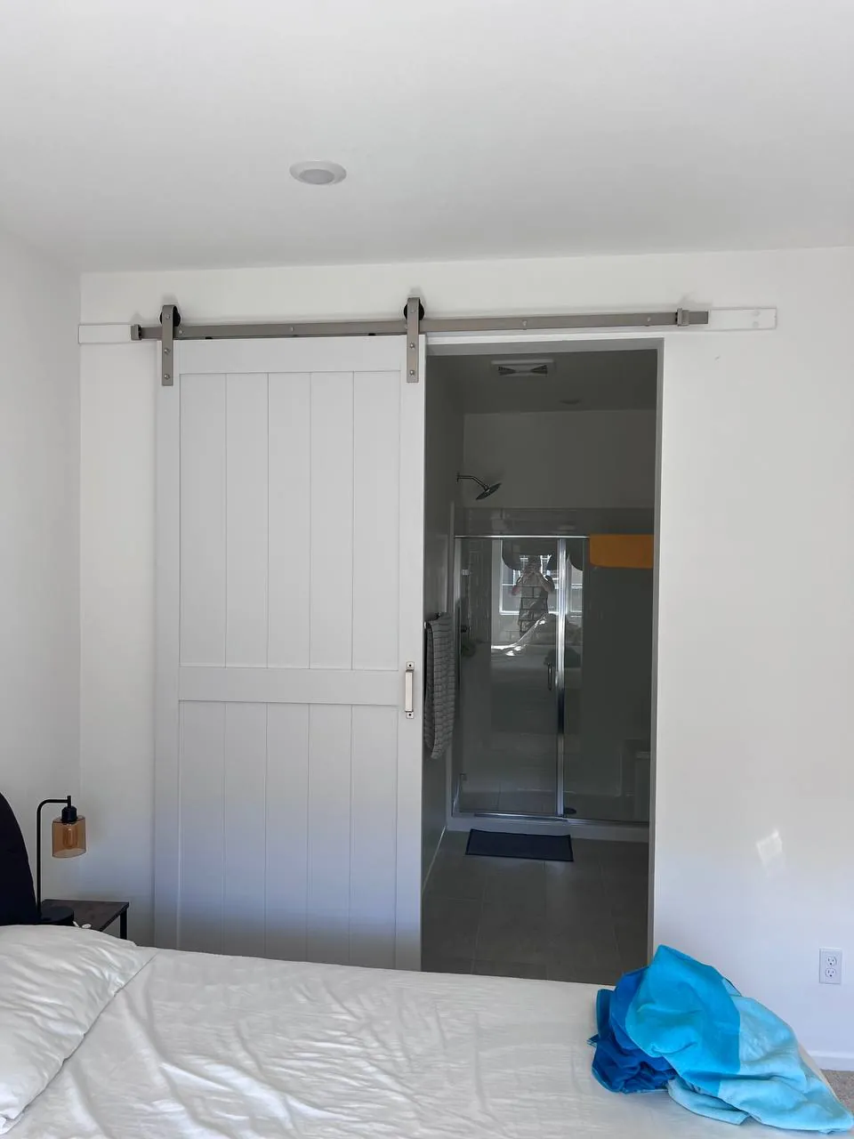 Sliding barn door installed on a rail in a San Diego home