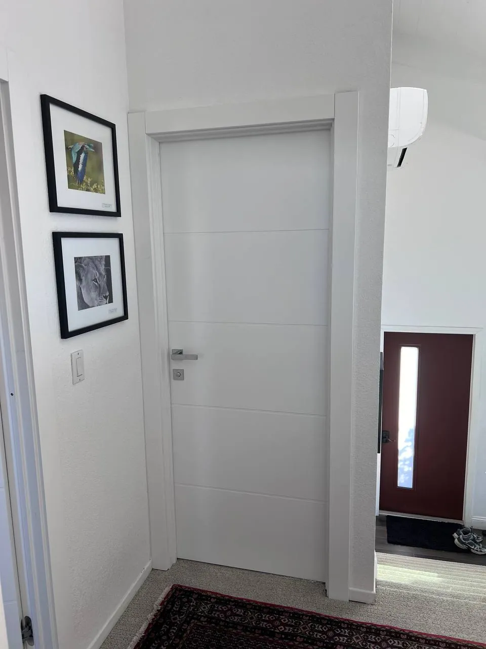 Freshly painted wall with framed art, clean finish