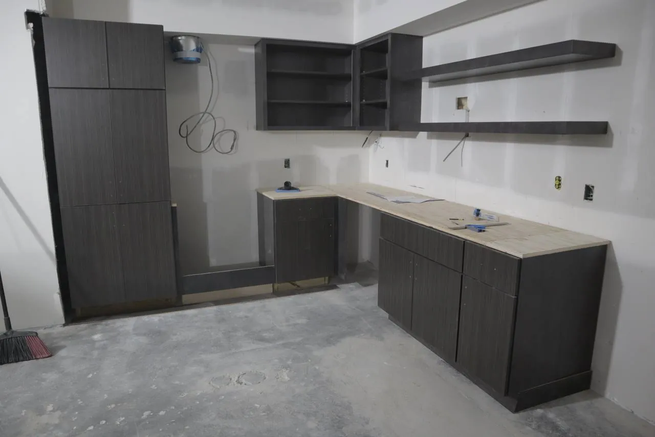 Dark modern kitchen cabinets with floating shelves