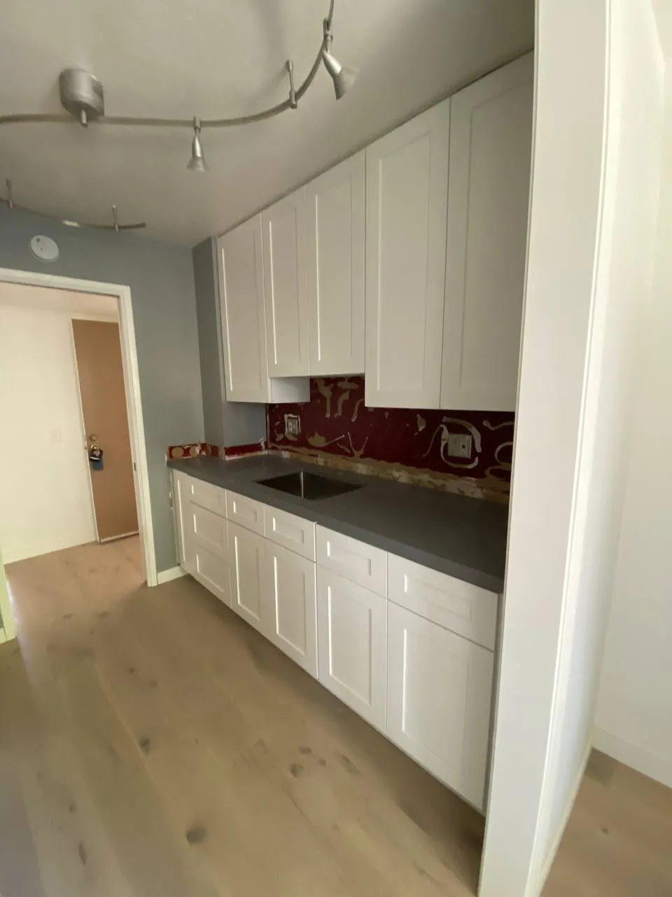 White shaker cabinets with new countertops