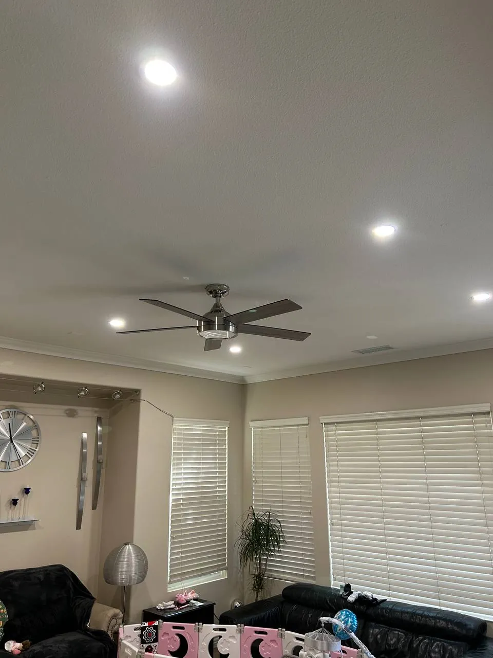 Ceiling fans installed in a vaulted San Diego living room
