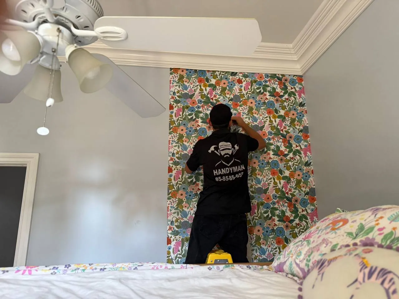Finished kids-room feature wall with patterned wallpaper
