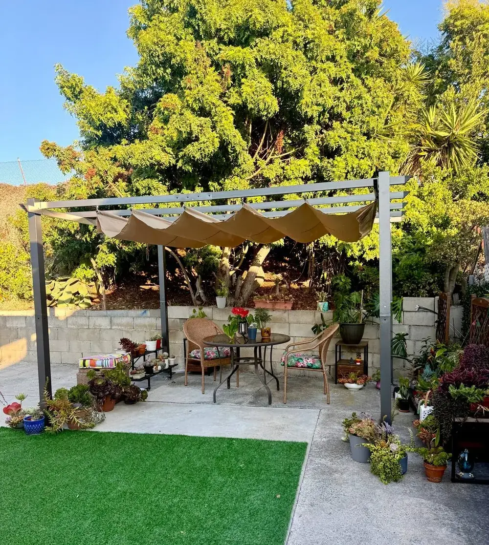 Pergola, artificial turf and planters in a San Diego backyard