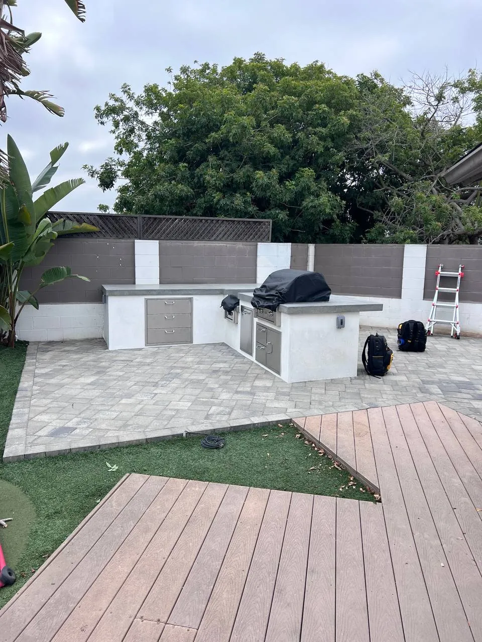 Outdoor kitchen and turf patio build