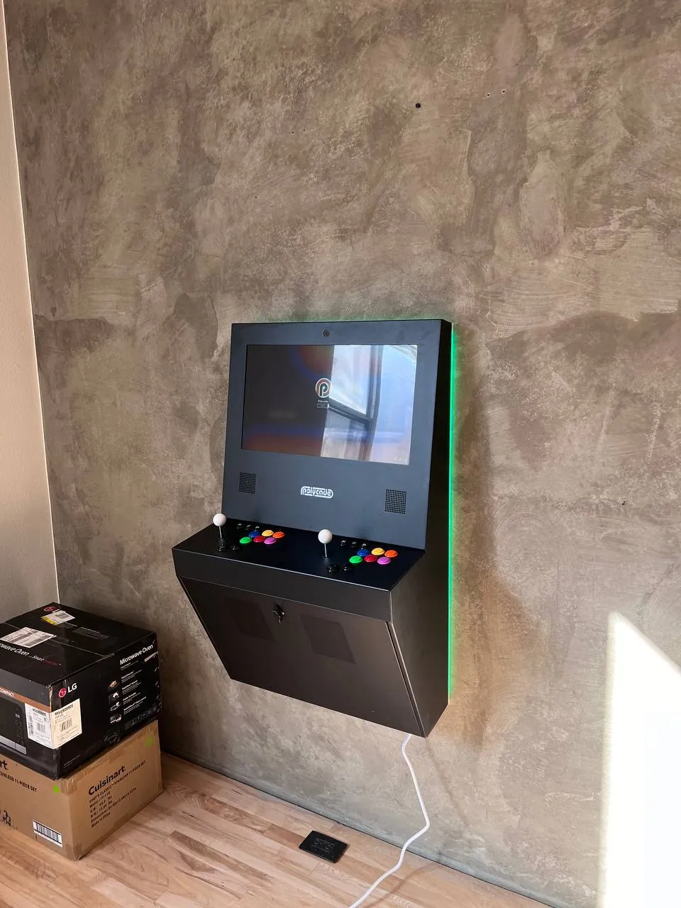 Flat-screen TV mounted with concealed cables on a gray feature wall