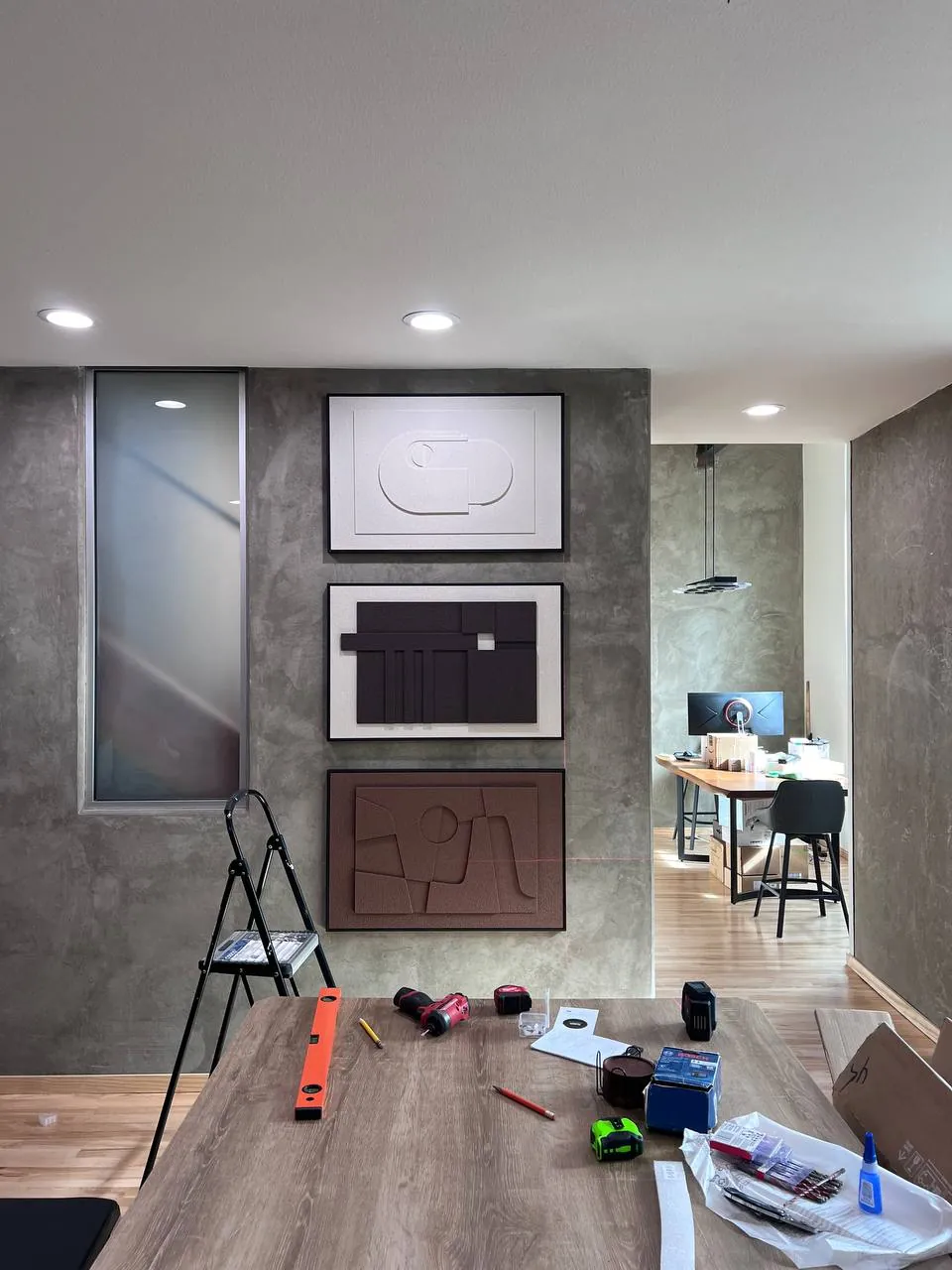 Large TV wall-mounted above a media console in San Diego
